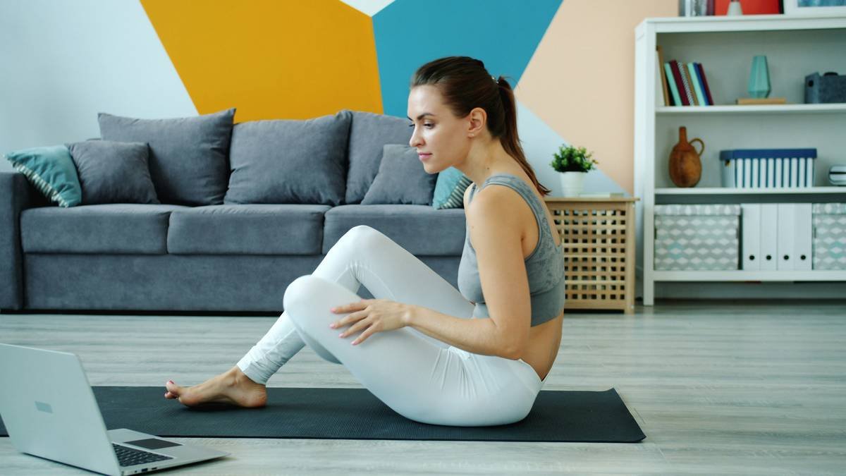 lean bodyweight workout plan featuring a person performing a pistol squat in a home gym setting